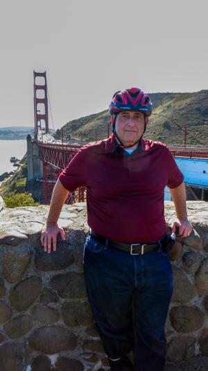 Person riding a bicycle over the Golden Gate Bridge